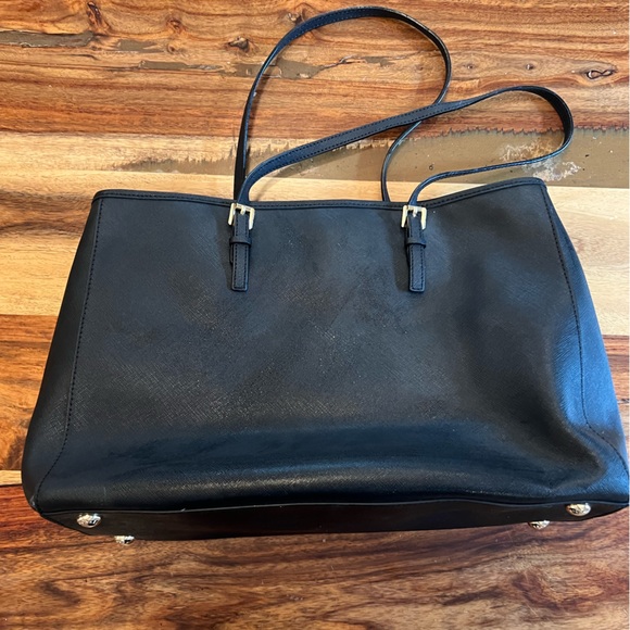Black hard leather Michael kors handbag. 14 inches wide by 10 inches tall. - Picture 7 of 7